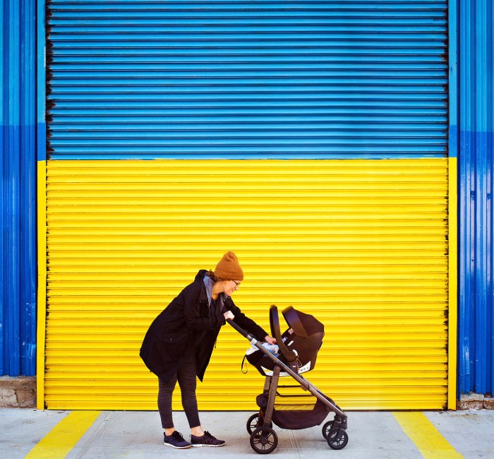 A woman pushing a stroller symbolizes the importance of planning for a secure future and enjoying life in retirement